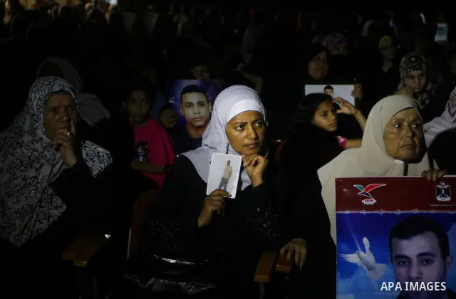Women watch as Palestinian actors perform at al-Shawwa theatre a play appear the hard life of Palestinian prisoners inside the Israeli jails, in Gaza city on Sep 3,2011. About 7,500 Palestinian prisoners are held in Isra...