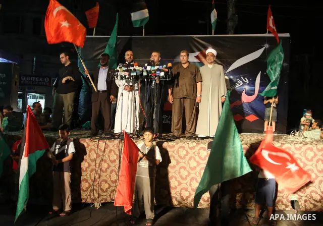Palestinians wave with their national flag and Turkish flag during a rally in support to Turkish decision in Gaza city on Sep. 3,2011. Turkey said Friday it was expelling the Israeli ambassador and cutting military ties...