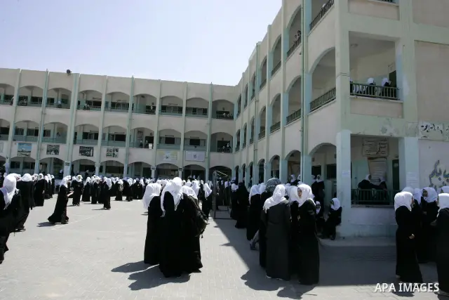 Palestinian students return back to their school in the morning of the first day of the new year study in Rafah, southern Gaza Strip on Sep. 4, 2011. Photo by Abed Rahim Khatib