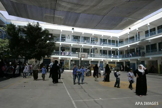 Palestinian students return back to their school in the morning of the first day of the new year study in Rafah, southern Gaza Strip on Sep. 4, 2011. Photo by Abed Rahim Khatib