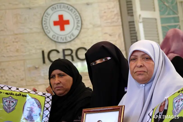Palestinian women hold pictures of their prisoned relatives in Israeli jails as they gather in a weekly activity calling for their liberty at the Red Cross headquarters in Gaza City onSep. 5, 2011. About 7000 prisoners a...