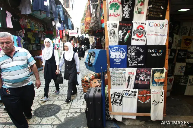 Palestinian students walk in a street after they returned back from their school on the second day of the new studing year, in Jerusalem's old city on Sep. 5,2011. Photo by Mahfouz Abu Turk