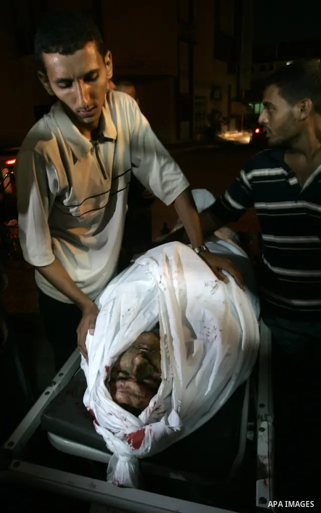 The body of a Palestinian militant killed in an Israeli air strike on Gaza on September 6, 2011 is wrapped in a white sheet at the mortuary of a hospital in the central Gaza Strip city of Khan Yunis. The strike, east of...