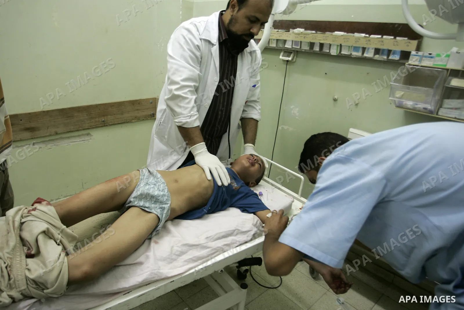 A wounded Palestinian boy receives medical care on September 6, 2011 at a hospital in Khan Yunis, following an Israeli air strike east of the central Gaza Strip city in which a Palestinian militant was killed and three c...