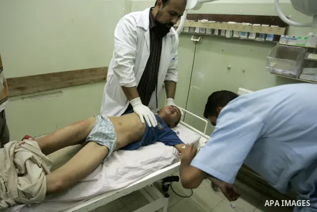 A wounded Palestinian boy receives medical care on September 6, 2011 at a hospital in Khan Yunis, following an Israeli air strike east of the central Gaza Strip city in which a Palestinian militant was killed and three c...