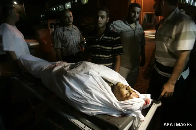 The body of a Palestinian militant killed in an Israeli air strike on Gaza on September 6, 2011 is wrapped in a white sheet at the mortuary of a hospital in the central Gaza Strip city of Khan Yunis. The strike, east of...