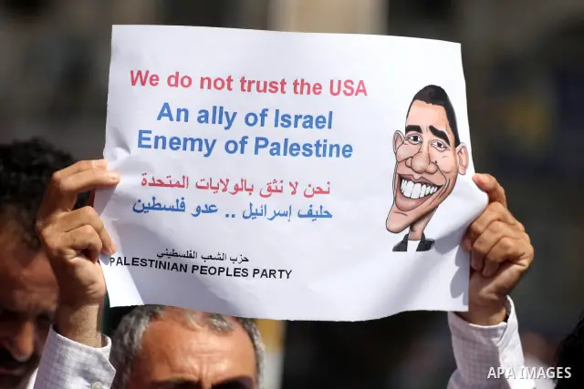 Palestinians stage a protest against US policies towards the Palestinians, ahead a visit by senior US envoys, in the West Bank city of Ramallah on Sep. 7, 2011. President Mahmud Abbas (Abu Mazen) during holding talks wit...