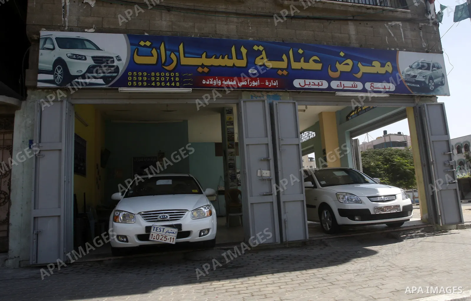 Cars are displayed at a showroom in Gaza City on Sep. 7, 2011. while Israel stop to enter cars into Gaza Strip again after it allowed to enter them as a part of a new strategy to increase Gaza blockade. Photo by Mahmud N...
