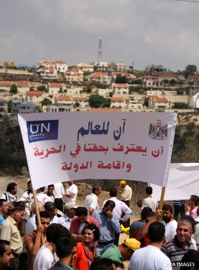 Palestinians march towards the gate of Qadomim during the weekly protest against the settlement of Qadomim, near the village of Kofr Qadom, west of Nablus City, in the Israeli-occupied West Bank on 09 September 2011. Pho...