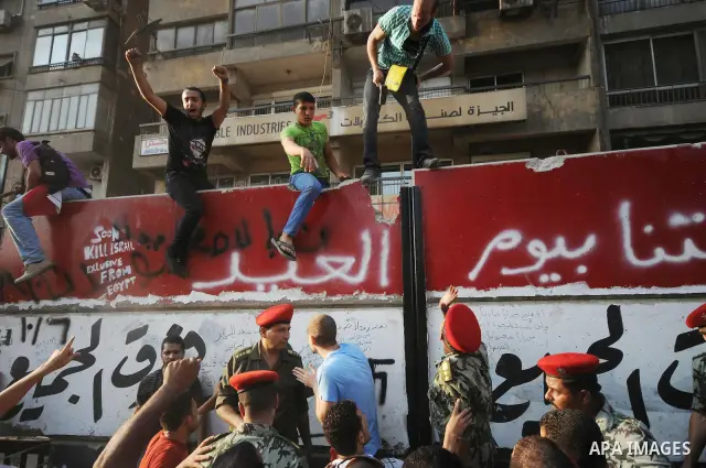 Egyptian protesters dismantle the concrete wall which was built in front of the Israeli embassy, in Cairo, Egypt, 09 September 2011. Security forces had built the wall in an attempt to secure the embassy after a series o...