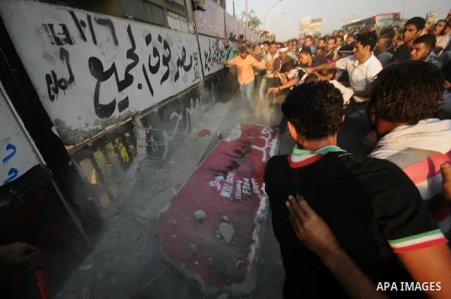 Egyptian protesters dismantle the concrete wall which was built in front of the Israeli embassy, in Cairo, Egypt, 09 September 2011. Security forces had built the wall in an attempt to secure the embassy after a series o...