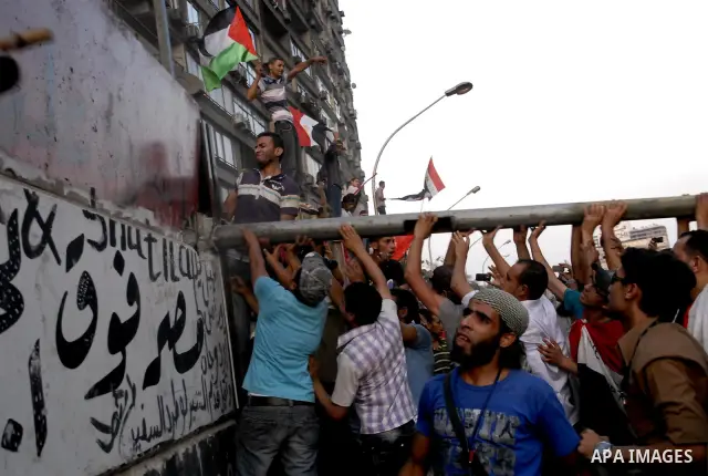 Egyptian protesters dismantle the concrete wall which was built in front of the Israeli embassy, in Cairo, Egypt, 09 September 2011. Security forces had built the wall in an attempt to secure the embassy after a series o...