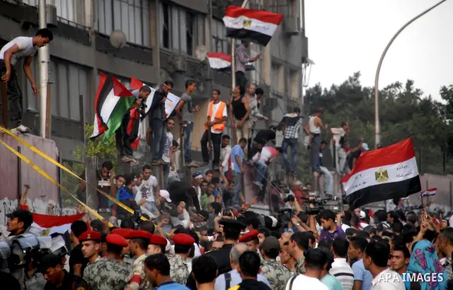 Egyptian protesters dismantle the concrete wall which was built in front of the Israeli embassy, in Cairo, Egypt, 09 September 2011. Security forces had built the wall in an attempt to secure the embassy after a series o...