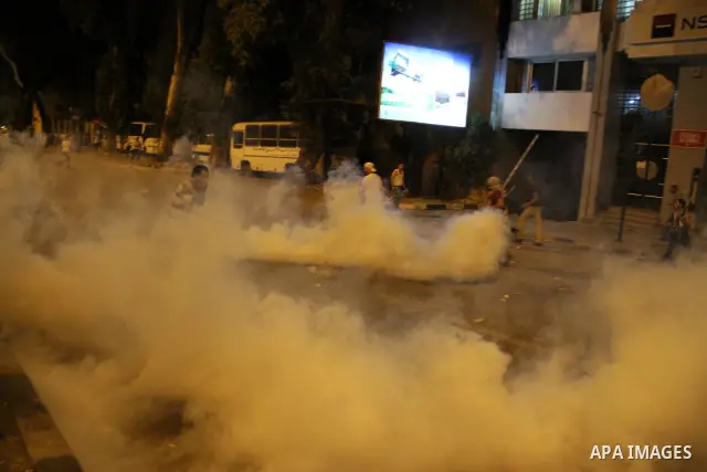 Egyptian demonstrators clash with police early on September 10, 2011 outside the Israeli embassy in Cairo after protesters raided the building. Photo by Ahmed Asad