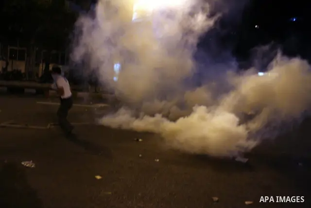 Egyptian demonstrators throw stones at police early on September 10, 2011 during clashes outside the Israeli embassy in Cairo after protesters raided the building. Photo by Ahmed Asad