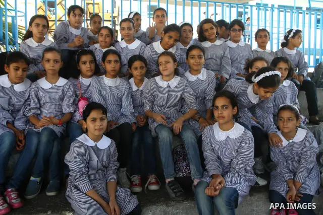 Palestinian students crammed in the schools of Relief and Works Agency refugees "UNRWA" studying at the "containers" made of tin because of overcrowding and the inability to accommodate large numbers of students in Gaza...
