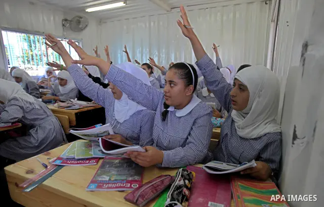 Palestinian students crammed in the schools of Relief and Works Agency refugees "UNRWA" studying at the "containers" made of tin because of overcrowding and the inability to accommodate large numbers of students in Gaza...