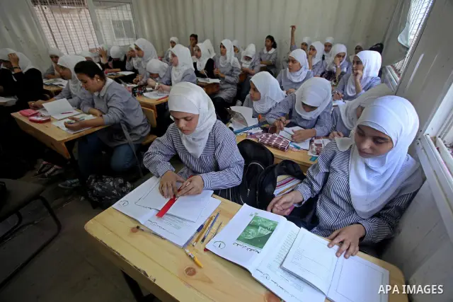 Palestinian students crammed in the schools of Relief and Works Agency refugees "UNRWA" studying at the "containers" made of tin because of overcrowding and the inability to accommodate large numbers of students in Gaza...
