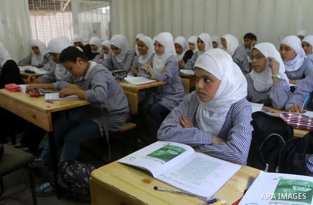 Palestinian students crammed in the schools of Relief and Works Agency refugees "UNRWA" studying at the "containers" made of tin because of overcrowding and the inability to accommodate large numbers of students in Gaza...