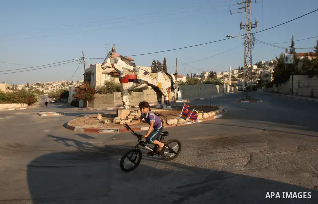 A Palestinian boy rides the bicycle inside the Jenin refugee camp West Bank city of Jenin on Sep. 12, 2011. Photo by Wagdi Eshtayah