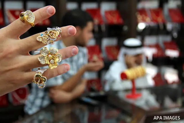 A Palestinian goldsmith displays Chinese jewellery at a jewellery shop in the southern Gaza Strip town of Rafah on September 12, 2011. The price of the Chinese gold is 15 dollars instead of 50 dollars for the other origi...