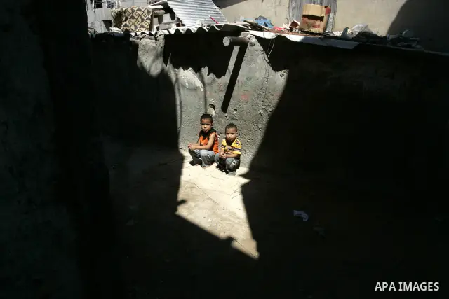 Palestinian children sit in the street in the Rafah Refugee Camp, Southern Gaza Strip on September 13, 2011. A diplomatic showdown looms at the United Nations this month when Palestinian President Mahmoud Abbas is expect...