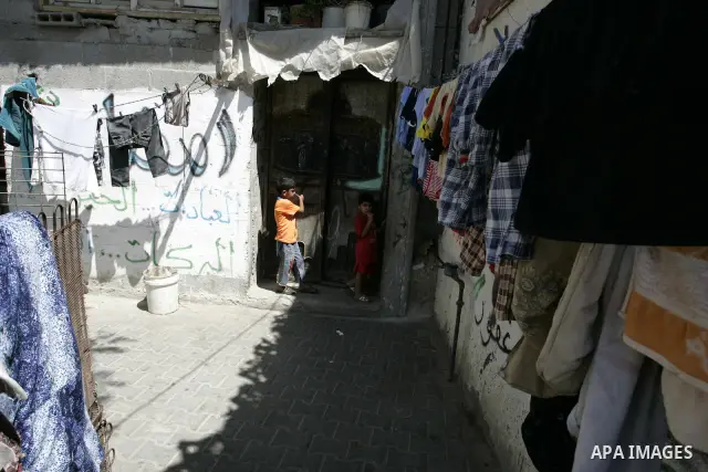 Palestinian children stand in the street in the Rafah Refugee Camp, Southern Gaza Strip on September 13, 2011. A diplomatic showdown looms at the United Nations this month when Palestinian President Mahmoud Abbas is expe...
