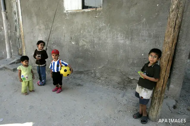 Palestinian children stand in the street in the Rafah Refugee Camp, Southern Gaza Strip on September 13, 2011. A diplomatic showdown looms at the United Nations this month when Palestinian President Mahmoud Abbas is expe...