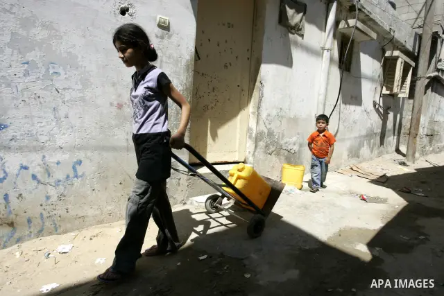 Palestinian children walk at the street in the Rafah Refugee Camp, Southern Gaza Strip on September 13, 2011. A diplomatic showdown looms at the United Nations this month when Palestinian President Mahmoud Abbas is expec...