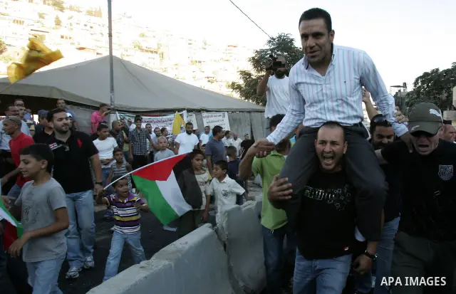 A Palestinian freed prisoner, Adnan Gheith is welcomed by his relatives in the east Jerusalem neighborhood of Silwan on Sep. 13, 2011 after he was released from an Israeli jails. Photo by Mahfouz Abu Turk