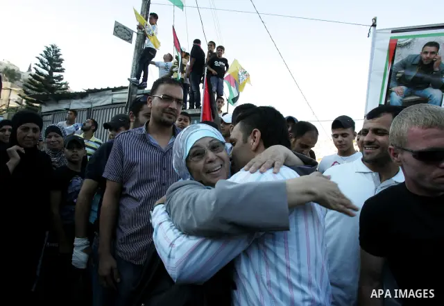 A Palestinian freed prisoner, Adnan Gheith is welcomed by his relatives in the east Jerusalem neighborhood of Silwan on Sep. 13, 2011 after he was released from an Israeli jails. Photo by Mahfouz Abu Turk