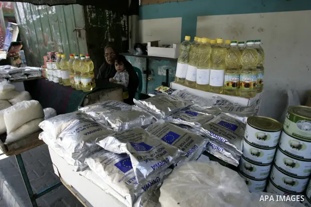 Palestinians receive their food aid from a UN distribution centre in the Rafah refugee camp, southern Gaza Strip on Sep. 14, 2011. Germany provided for the first time a donation to the school's nutrition program, and the...