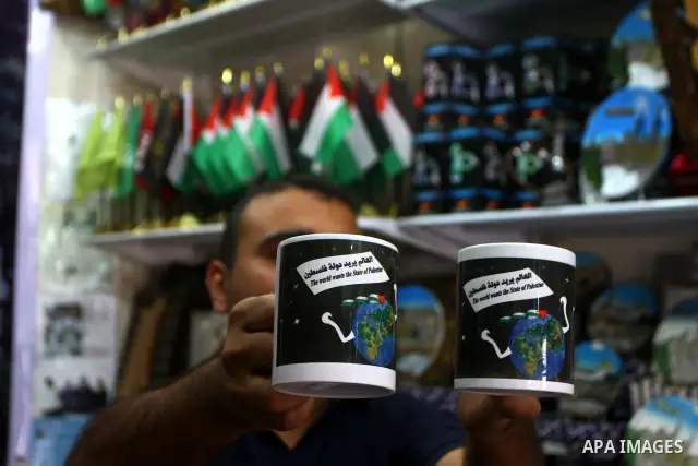 Coffee mugs stand for sale at a souvenirs shop in Gaza City as part of the campaign promoting the Palestinians' bid for statehood on September 14, 2011. The Palestinians are preparing to submit a formal request to become...