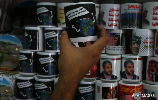 Coffee mugs stand for sale at a souvenirs shop in Gaza City as part of the campaign promoting the Palestinians' bid for statehood on September 14, 2011. The Palestinians are preparing to submit a formal request to become...