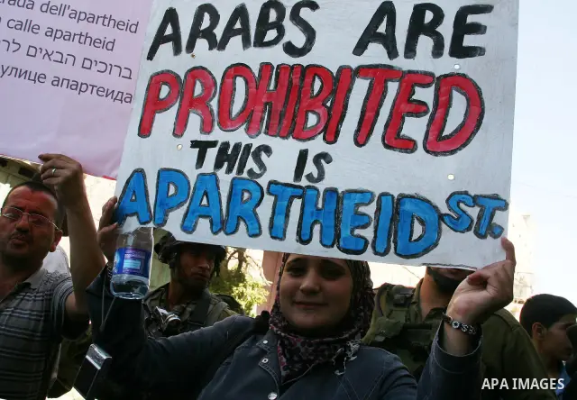 Palestinians take part in a rally against the closure of Shuhada Street in Hebron, the main artery blocked by an Israeli military checkpoint in the center of the West Bank town of Hebron Sep. 14, 2011. Palestinians demon...