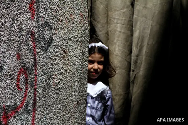 A Palestinian girl stands outside her house in al-Shate` refugee camp in Gaza City, on Sep. 15, 2011. President Mahmoud Abbas's bid to seek U.N. recognition of a Palestinian state is not generating much enthusiasm in the...