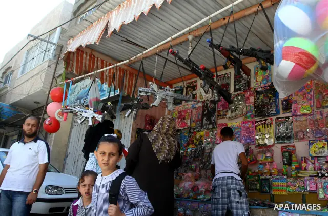 Palestinians stand infront of a shop for games in al-Shate` refugee camp in Gaza City, on Sep. 15, 2011. President Mahmoud Abbas's bid to seek U.N. recognition of a Palestinian state is not generating much enthusiasm in...