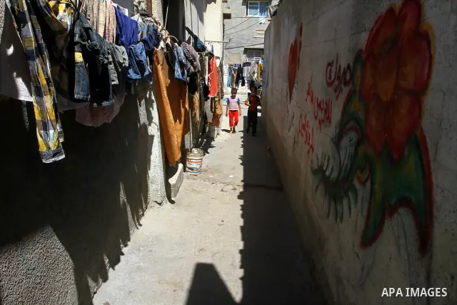 Palestinian children walk outside their house in al-Shate` refugee camp in Gaza City, on Sep. 15, 2011. President Mahmoud Abbas's bid to seek U.N. recognition of a Palestinian state is not generating much enthusiasm in t...