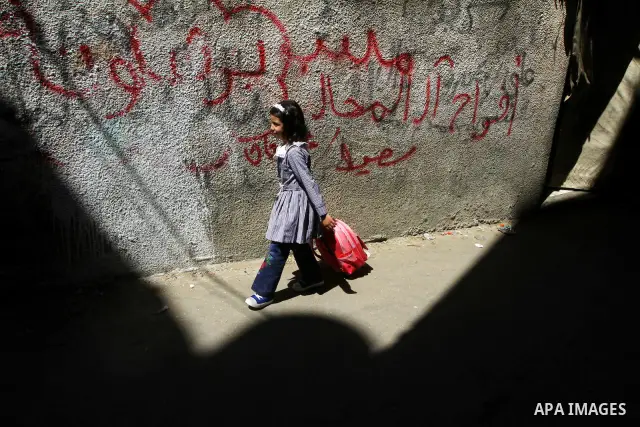 A Palestinian girl walks in al-Shate` refugee camp in Gaza City, on Sep. 15, 2011. President Mahmoud Abbas's bid to seek U.N. recognition of a Palestinian state is not generating much enthusiasm in the isolated Gaza Stri...
