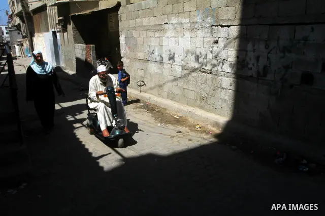 A Palestinian old man sits on his wheelchair in al-Shate` refugee camp in Gaza City, on Sep. 15, 2011. President Mahmoud Abbas's bid to seek U.N. recognition of a Palestinian state is not generating much enthusiasm in th...