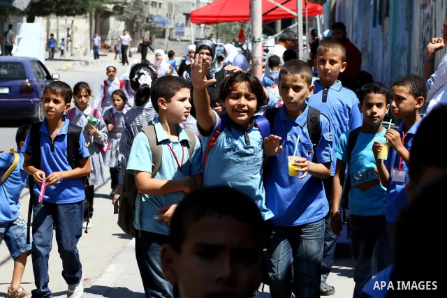 Palestinian students walk in the streets at al-Shate` refugee camp in Gaza City, on Sep. 15, 2011. President Mahmoud Abbas's bid to seek U.N. recognition of a Palestinian state is not generating much enthusiasm in the is...