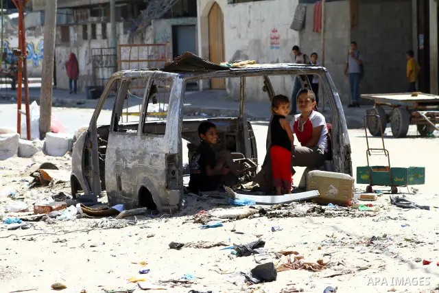 Palestinian children play inside old car in al-Shate` refugee camp in Gaza City, on Sep. 15, 2011. President Mahmoud Abbas's bid to seek U.N. recognition of a Palestinian state is not generating much enthusiasm in the is...