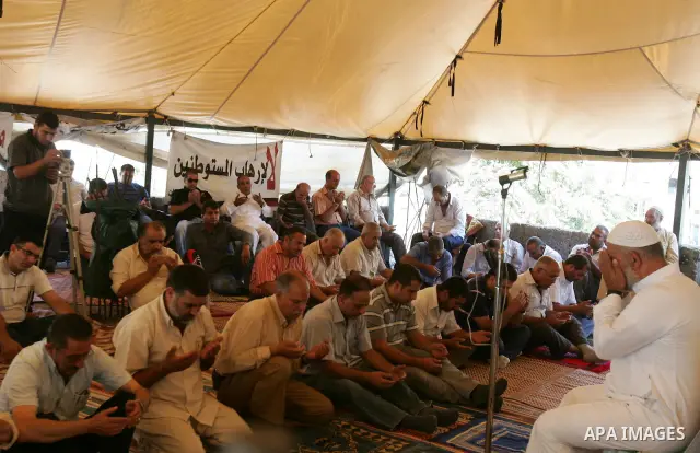 Palestinians attend Friday prayers at the protest tent in the Silwan neighborhood in East Jerusalem on Sep.16,2011 as Palestinian protesters gather for a demonstration. Photo by Mahfouz Abu Turk