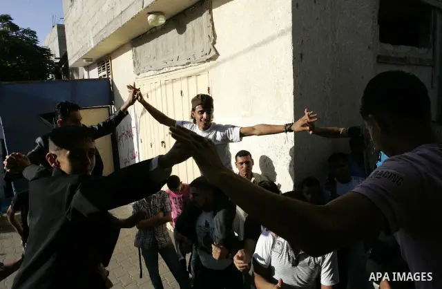Palestinian friends and relatives celebrated the groom, Mohamed Gouda 24 years old, in the Rafah refugee camp, southern Gaza Strip on the eve of his wedding on Sep. 16, 2011, during the traditional celebration, Gouda was...