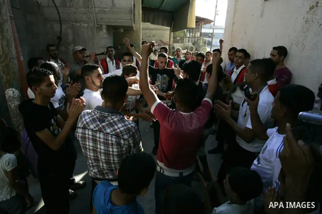 Palestinian friends and relatives celebrated the groom, Mohamed Gouda 24 years old, in the Rafah refugee camp, southern Gaza Strip on the eve of his wedding on Sep. 16, 2011, during the traditional celebration, Gouda was...
