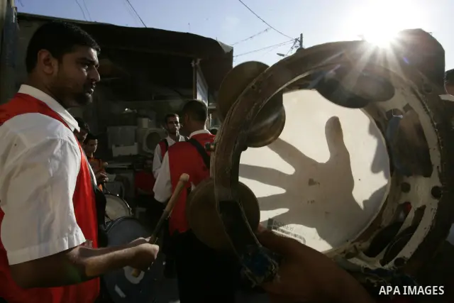 Palestinian friends and relatives celebrated the groom, Mohamed Gouda 24 years old, in the Rafah refugee camp, southern Gaza Strip on the eve of his wedding on Sep. 16, 2011, during the traditional celebration, Gouda was...
