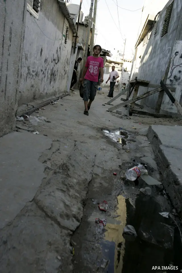 A Palestinian girl walks outside her house at Rafah refugee camp, southern Gaza Strip on Sep. 17, 2011. The Palestinians are preparing to submit a formal request to become the 194th member of the United Nations when the...