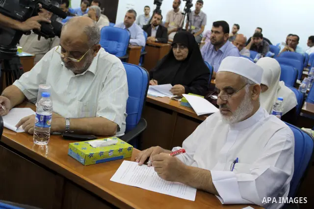 Palestinian Legislative Council members of the mass of change and reform, and a representative of the Hamas parliamentary bloc during a meeting in Gaza city on Sep. 18, 2011. Members of the Palestinian Legislative counci...