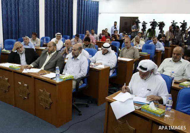 Palestinian Legislative Council members of the mass of change and reform, and a representative of the Hamas parliamentary bloc during a meeting in Gaza city on Sep. 18, 2011. Members of the Palestinian Legislative counci...