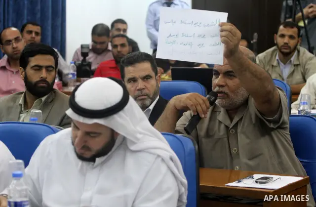 Palestinian Legislative Council members of the mass of change and reform, and a representative of the Hamas parliamentary bloc during a meeting in Gaza city on Sep. 18, 2011. Members of the Palestinian Legislative counci...